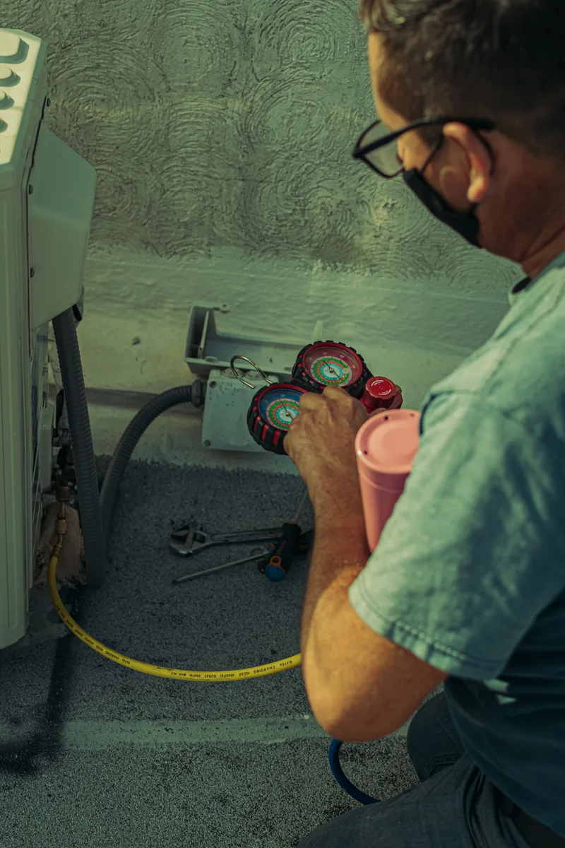Tech performing A/C repair